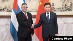El Ministro de Seguridad Pública chino, Wang Xiaohong con el Ministro del Interior cubano, Lázaro Alberto Álvarez Casas.