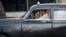 Un hombre maneja un viejo taxi particular en La Habana. 