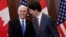 El premier canadiense Justin Trudeau y el vicepresidente de EEUU Mike Pence.
